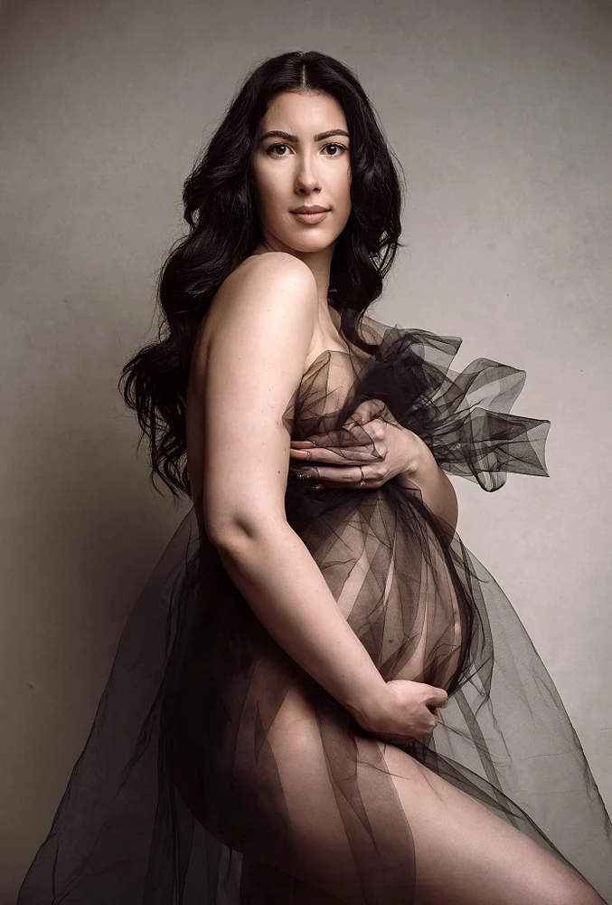 Elegant Maternity Portrait in Sheer Fabric