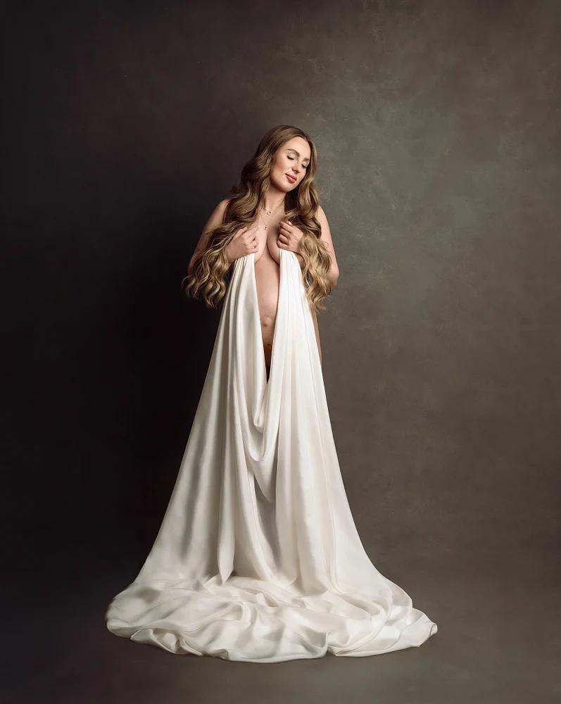 Elegant Portrait of a Woman in Flowing White Fabric