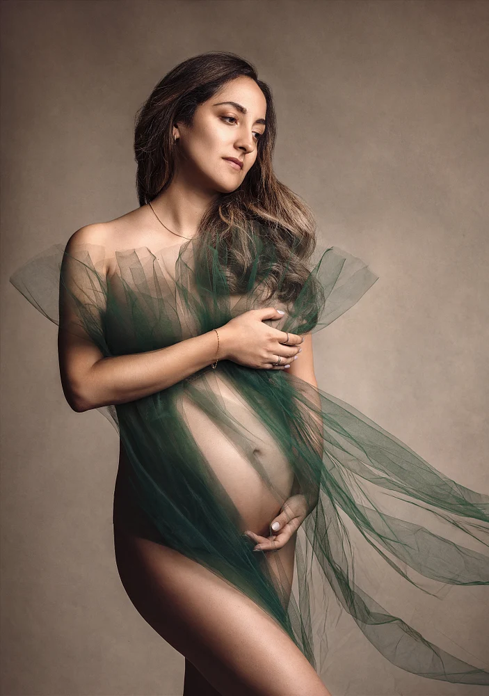 Elegant Portrait of a Woman Draped in Green Tulle