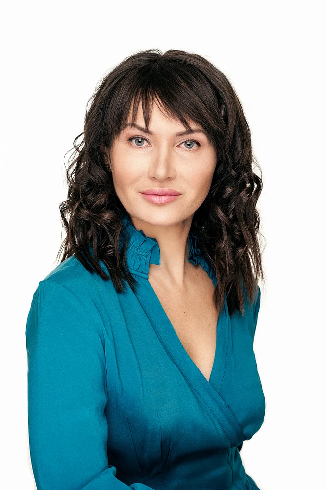 Professional Portrait of a Woman in a Teal Blouse
