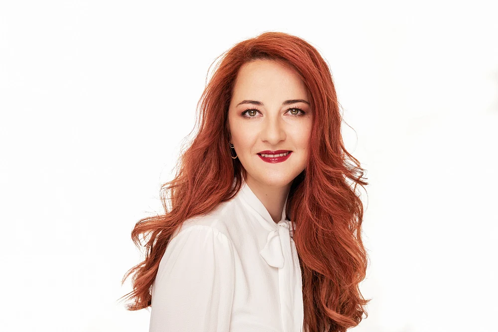 Professional Portrait of a Woman with Long Red Hair