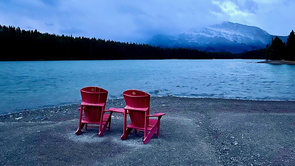 chairs facing mountains