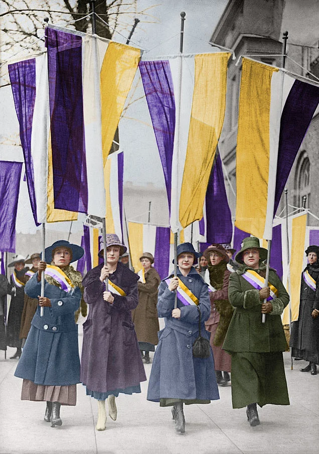 Women carrying Suffrage flags