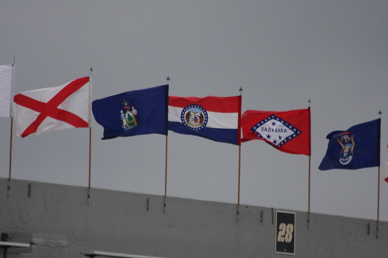 The flags of every state snap in the brisk wind over Michie Stadium