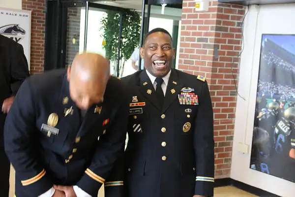 LT Cunningham and COL Williams share a laugh by...