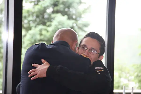A congratulatory man hug by ThomasCarroll235