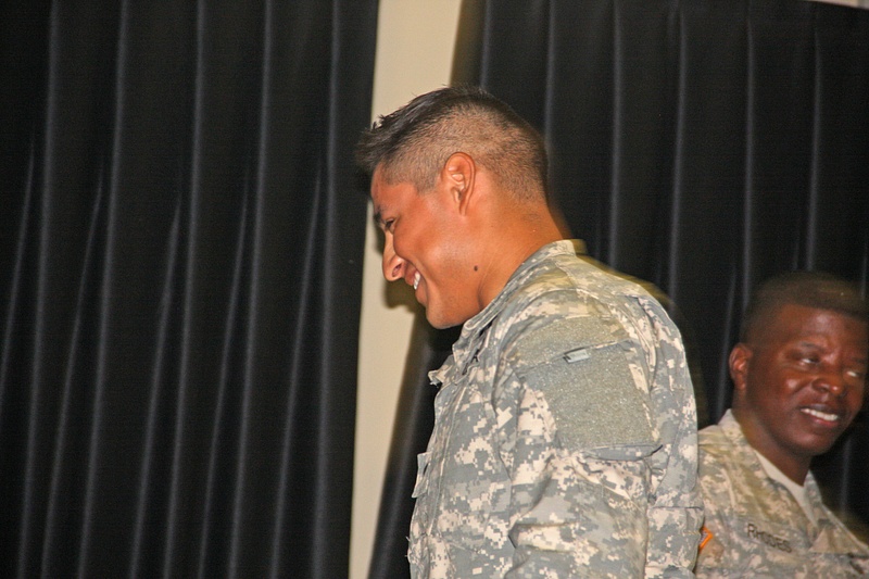 Gabe strolls off the podium with a grin from Company Commander Dwayne Rhodes