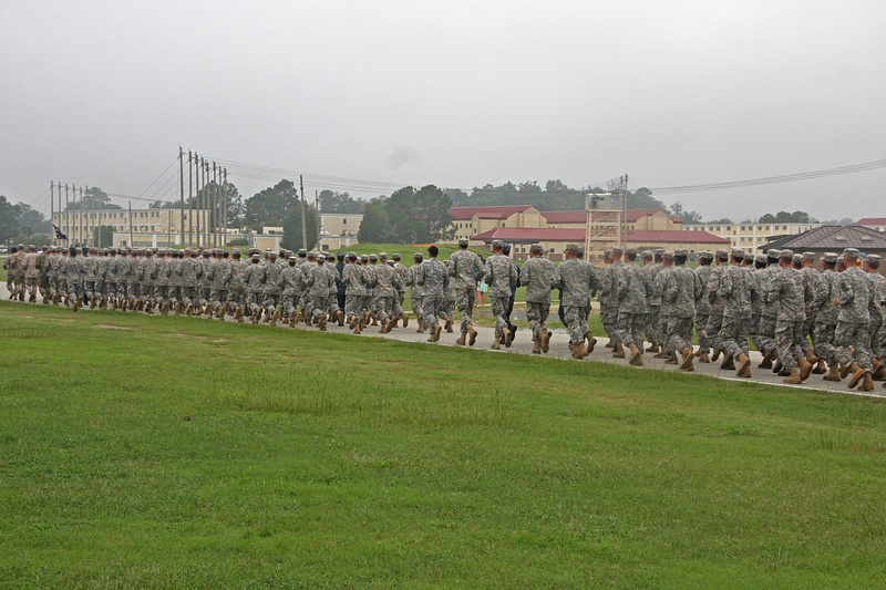 Airborne School  graduates and their instructors  move to the graduation exercises.