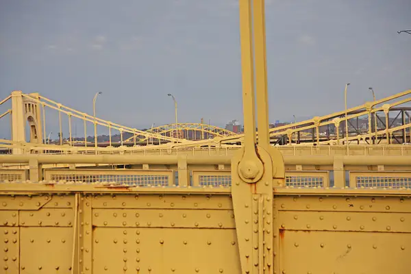 Many of Pittsburgh's bridges are yellow, or rather,...