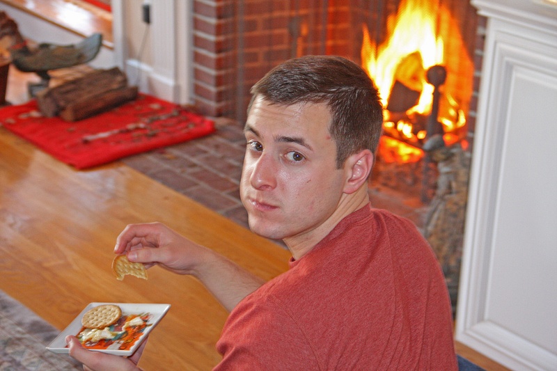 Jack enjoying cheese by the fireside