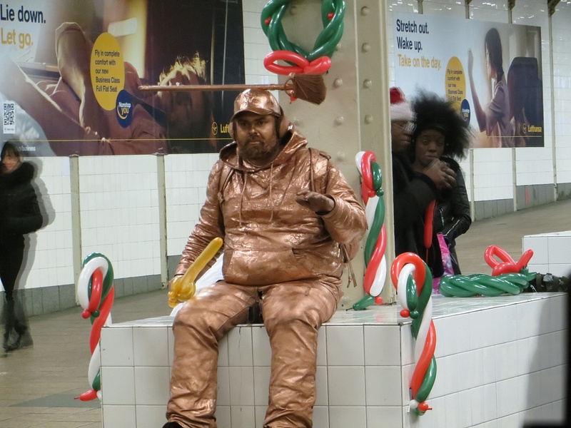 A mime near the crosstown subway shuttle