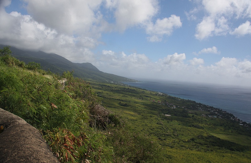 A lush hillside and the Caribbean beyond