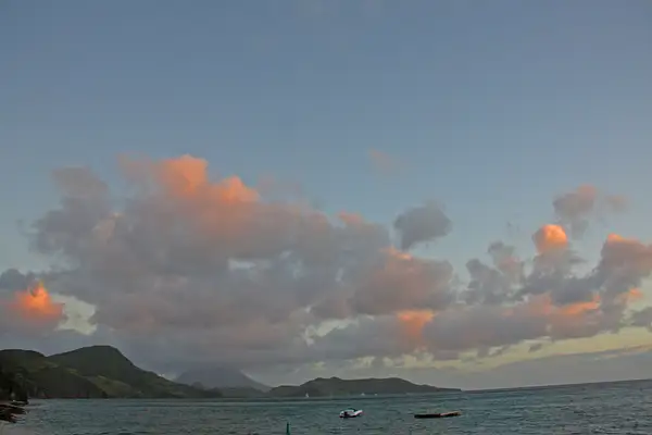 Pink tinged clouds at day's end in St Kitts by...