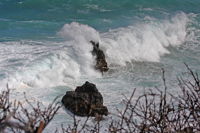 Constant wave action eroding the rock formations over the centuries