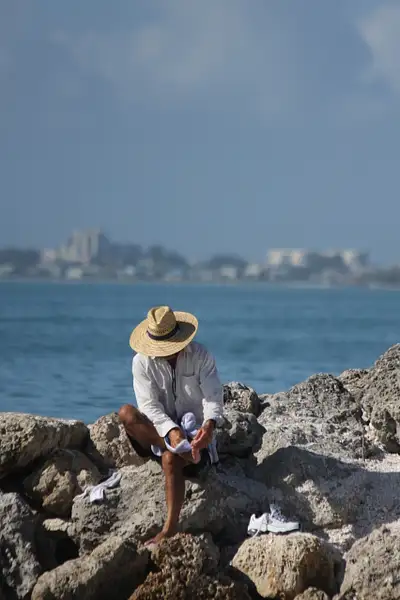Beachcomber on the rocks by ThomasCarroll235
