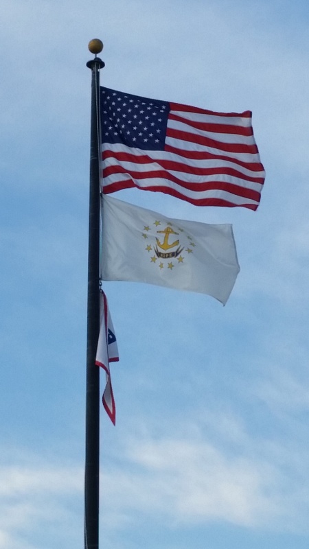 Rhode Island's flag snaps under the Stars and Stripes