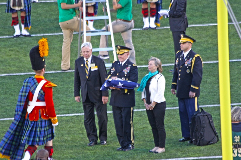 General Martin Dempsey, Chairman of the Joint Chiefs of Staff, presents the flag to the Irish Guard