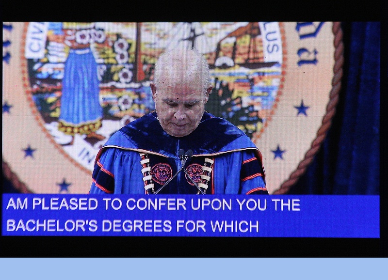 President Bernie Machen confers degrees to the graduates