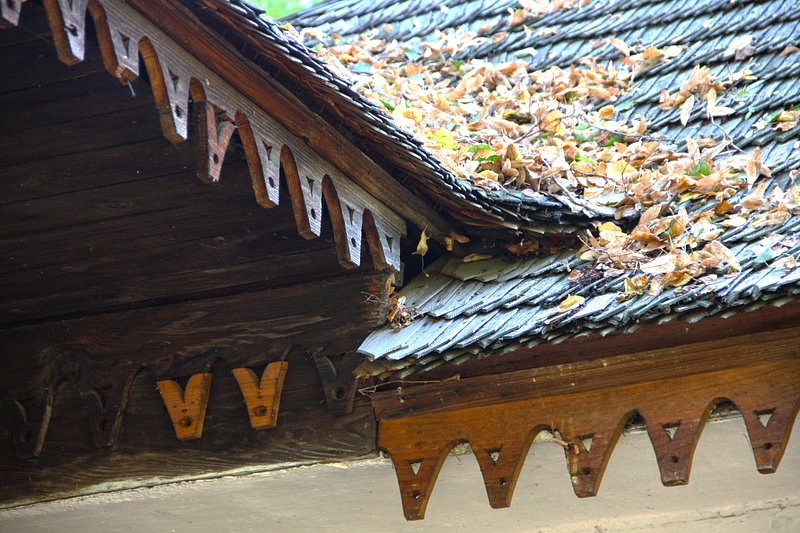 Intricate wood flashing and roof shingles