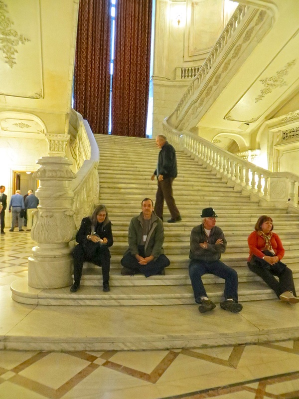 Parliament Palace. Paul adopts the lotus position as he meditates upon Ceaușescu's megalomania.