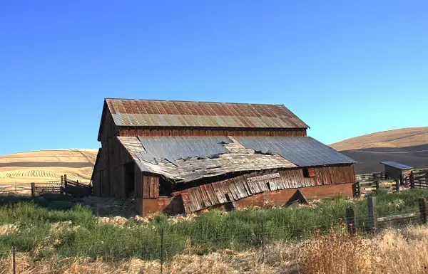 An old barn nears the end of its useful life west of...