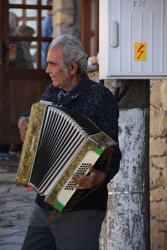 An accordianist entertains Arbanassi's visitors