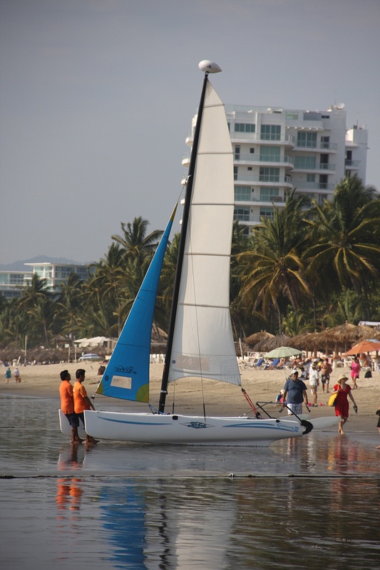 Getting ready to launch a Catamaran into the surf