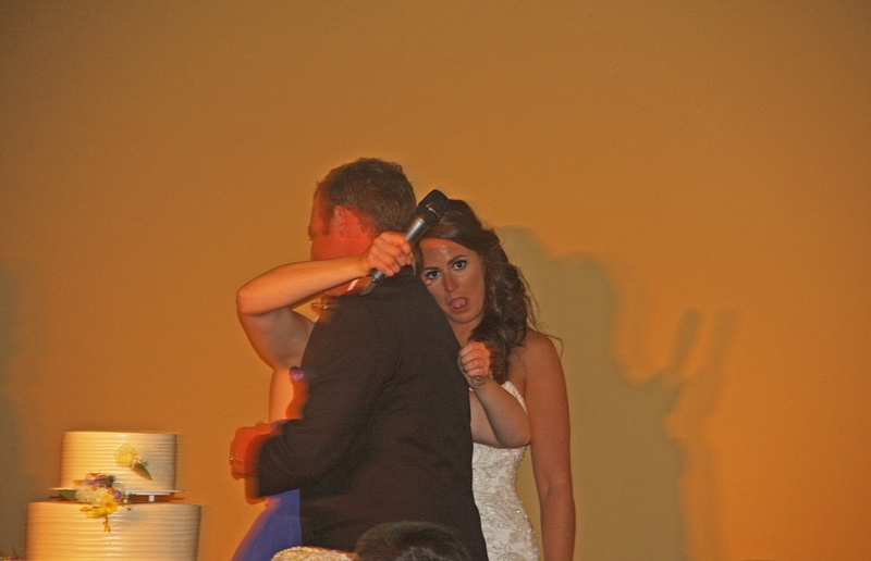 Maid of Honor and Groom embrace