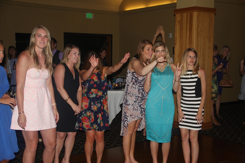 Single ladies eagerly await the bouquet toss