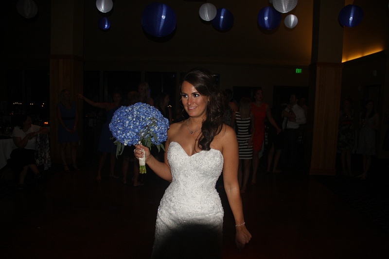 The bride prepares to toss the bouquet