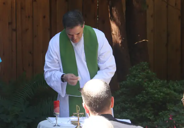 Father Paul celebrates Mass in the garden at David's and...