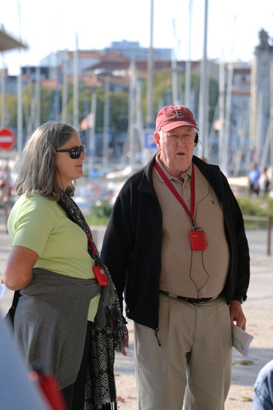 Georgia and Dave observing a game of Pétanque near La Rochelle's  old harbor