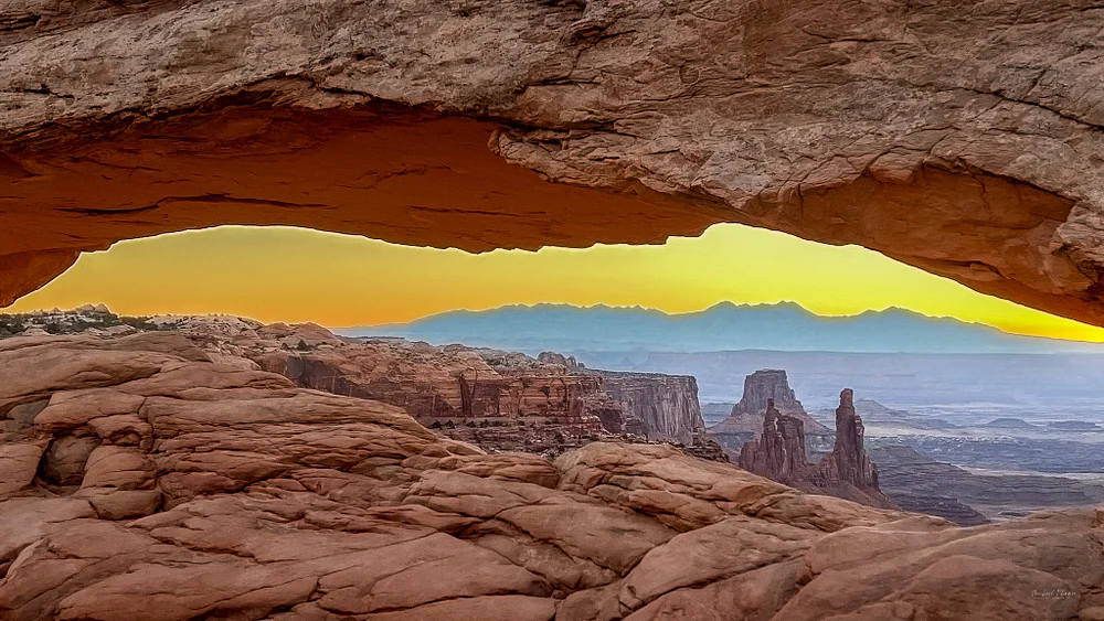 Sunrise Over Canyonlands National Park Through Natural Arch