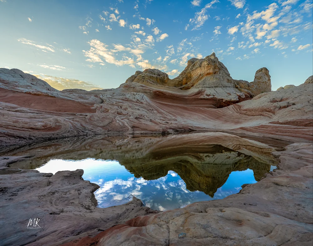 Serene Reflection at White Pocket's Unique Rock Formations
