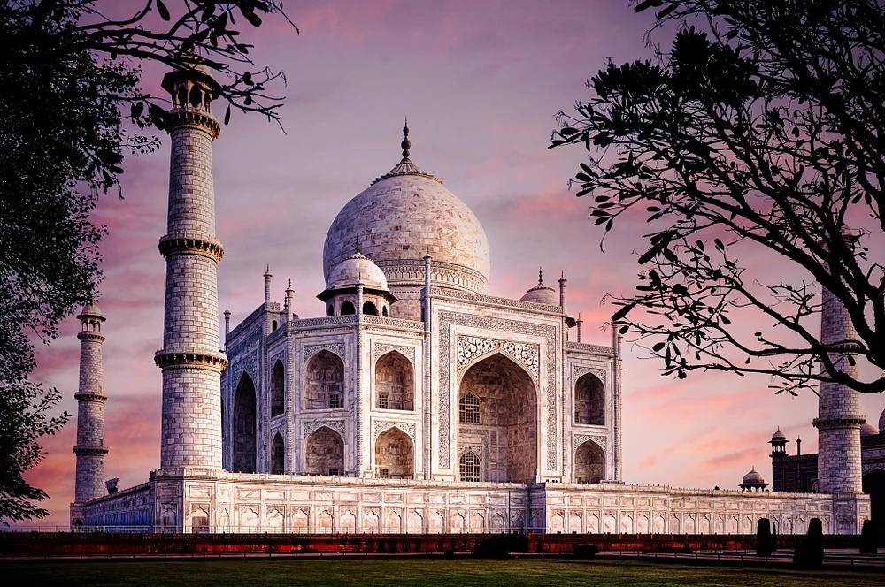 Stunning Taj Mahal Against a Dramatic Sunset Sky