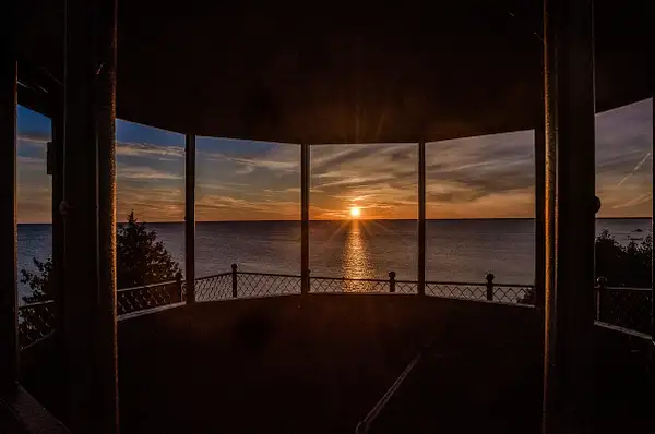 Sunset from inside Peninsula Point Light by SDNowakowski