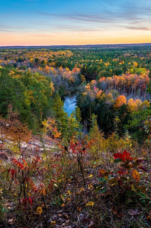 Fall colors on the Manistee River at Sunset