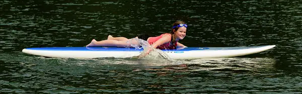 Rachel Brings In the Paddle Board by jgpittenger