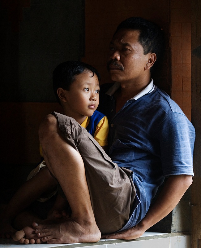 Son with father, Bali - Robert Fournier