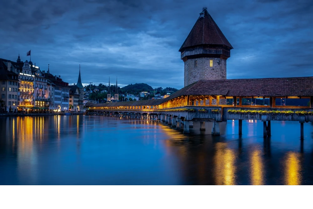 'Chapel Bridge in Lucerne Switzerland, considered to be Europe's oldest covered bridge. Building started in 1333 and is 673' lon
