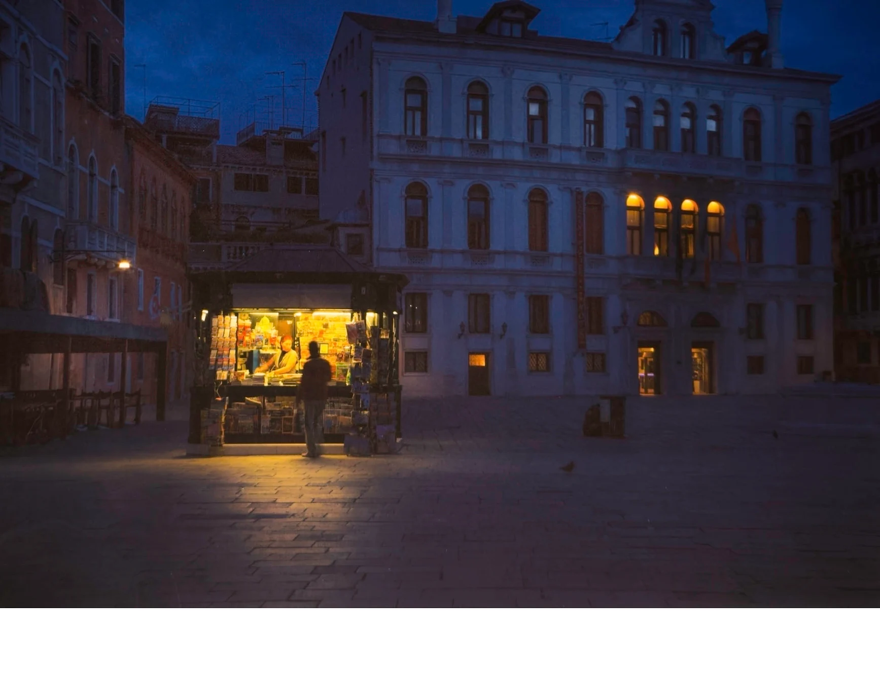 'A Newstand Open Late in the Evening so Tourists can Stop for Local News, Venice, Italy' (TB   Place) by Gene Morita - MR
