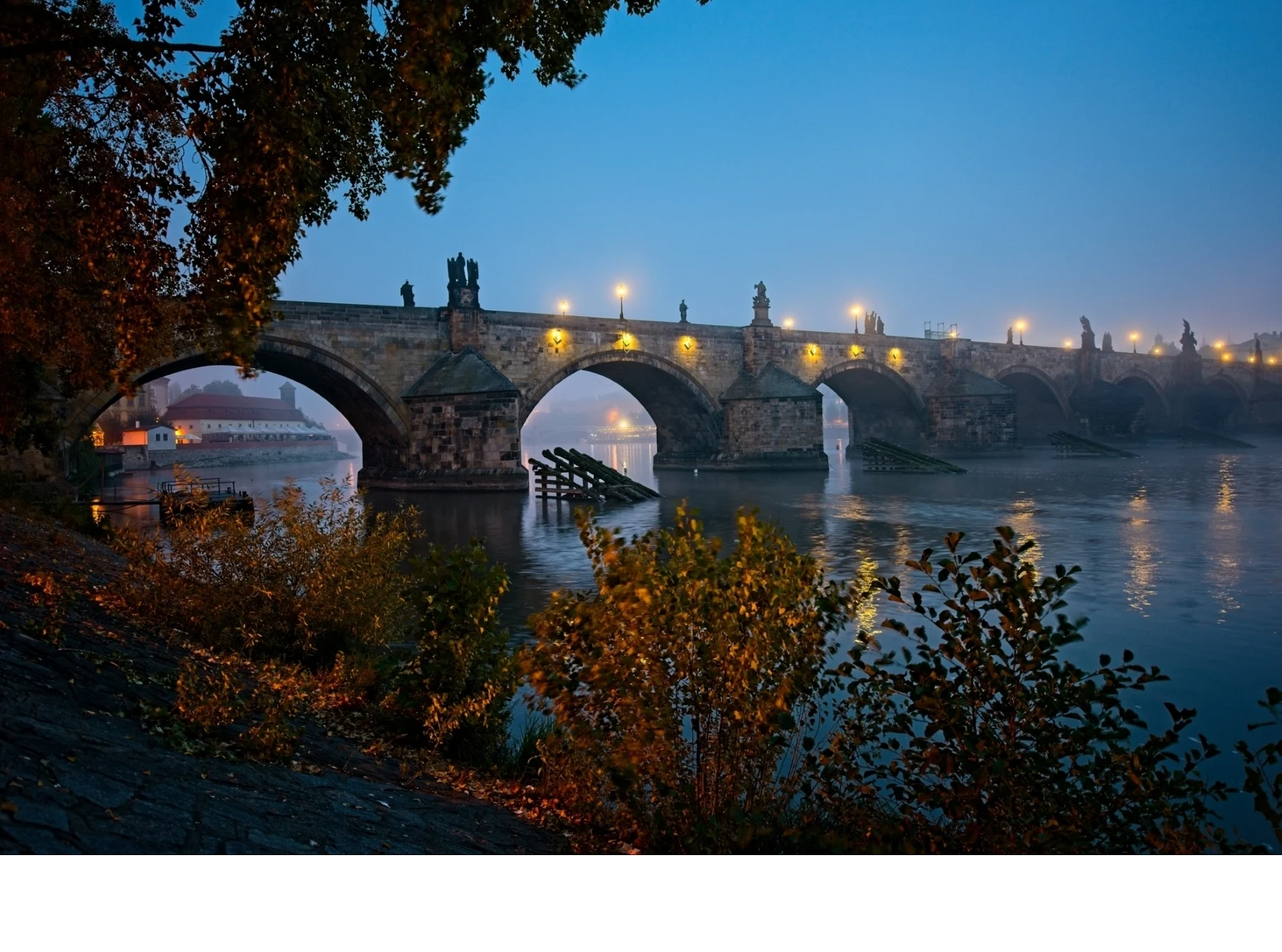 'Charles Bridge before dawn, Prague, Czech Republic. A medieval stone bridge constructed between 1357 and 1402. There are 30 Bar