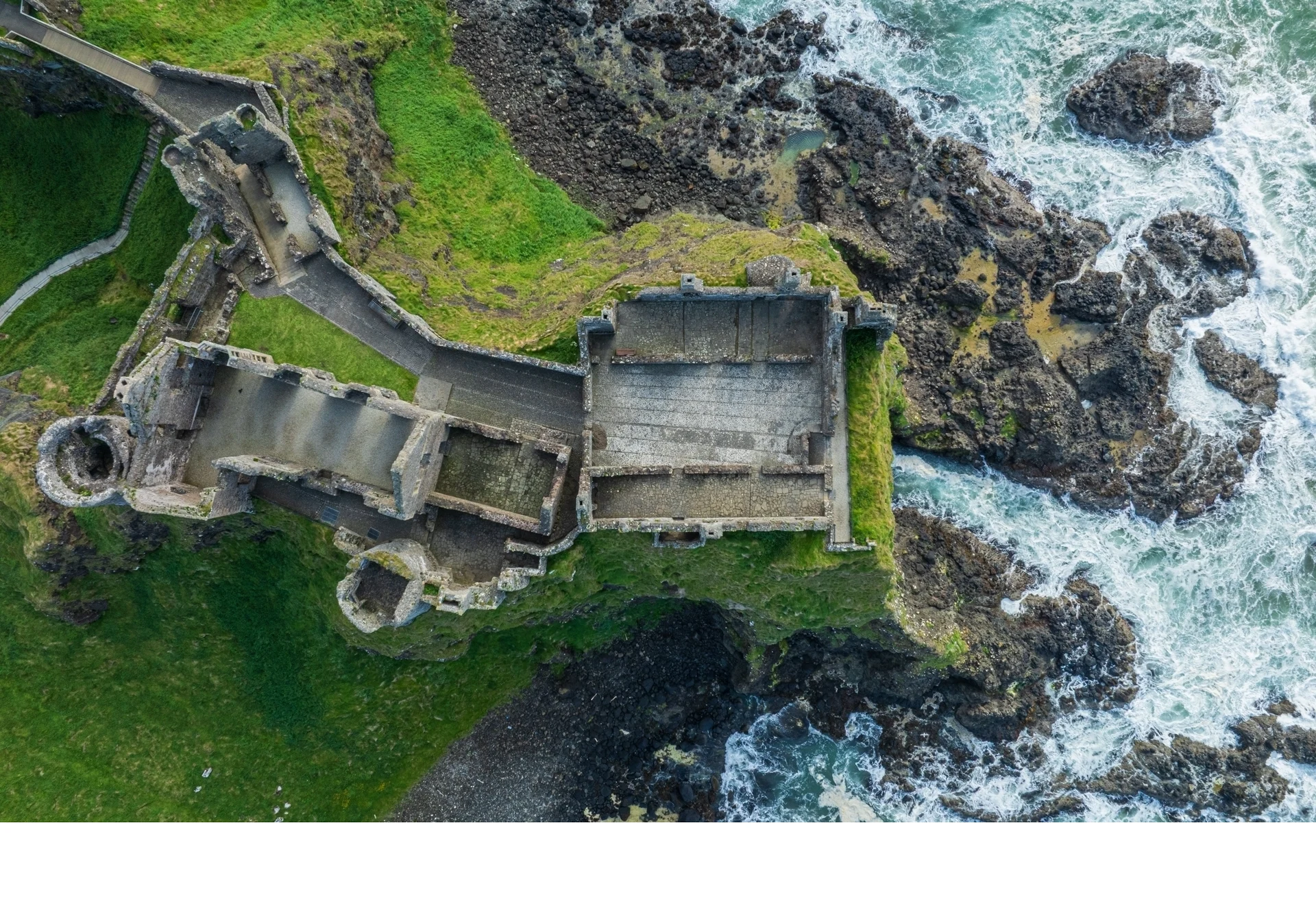 'High on the cliffs of Northern Ireland's Antrim coast, the 13th-century Dunluce Castle is one of Northern Ireland's most iconic